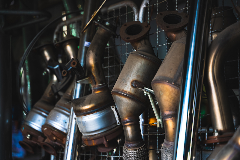 Car exhaust maintenance, rusted car exhaust pipes.