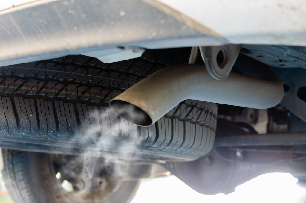 Car exhaust maintenance, smoke from car exhaust.
