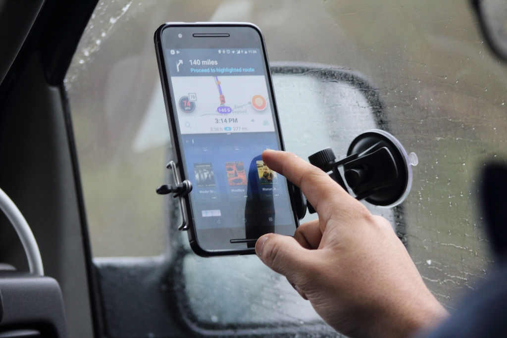 Smart car accessories, phone on vehicle mount.